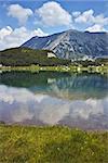 Reflection of Todorka peak in Muratovo lake, Pirin Mountain, Bulgaria