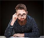 Portrait of a Teenage Hipster with Beard and Glasses