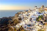 View of beautiful village of Oia with its whitewashed and colorful houses, Oia, Santorini, Greece, Europe