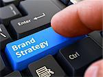 Brand Strategy Concept. Person Click on Blue Keyboard Button. Selective Focus. Closeup View.
