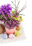 Easter still life with eggs and spring flowers. Isolated on white background