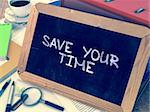 Save Your Time - Chalkboard with Hand Drawn Text, Stack of Office Folders, Stationery, Reports on Blurred Background. Toned Image.