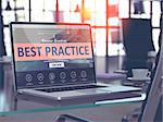 Best Practice Concept Closeup on Laptop Screen in Modern Office Workplace. Toned Image with Selective Focus.
