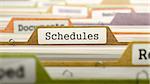 Schedules Concept on File Label in Multicolor Card Index. Closeup View. Selective Focus.