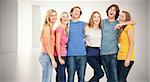 Full length of a group laughing together and looking at the camera  against digitally generated room