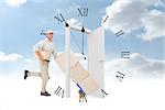 Happy delivery man with trolley of boxes running on white background against clock counting down to midnight