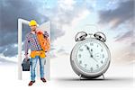 Handyman holding tool box and multimeter  against alarm clock counting down to twelve