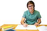 Student sitting in library writing against white background with vignette
