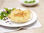 Coquille st jacques, scallops, potatoes and green salad leaves