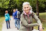 Portrait of senior woman on pathway in forest