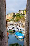 Framed view of fishing boats, Camogli, Liguria,  Italy