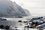 Snow covered mountains and fjord near Unstad, Lofoten Islands, Norway