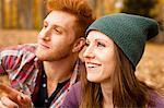 Happy young couple in autumn forest