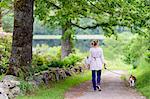 Woman walking dog