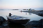 Boat on coast at dusk