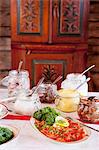 Variety of dishes and appetizers on dining table