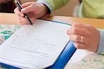 Man filling documents