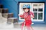 Girl riding small bicycle