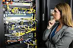 Technician looking at open server locker