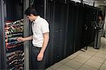 Team of technicians working on servers