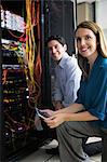 Team of technicians working together on servers