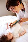 Newborn being visited by pediatrician