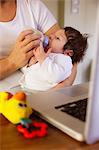 Newborn being fed by the mother