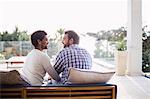 Happy couple sitting on sofa