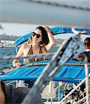 Woman enjoying view on sailboat, San Diego Bay, California, USA