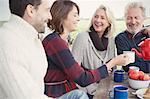 Couples drinking coffee on patio