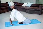 Woman exercising on mat