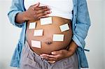 Pregnant woman with stcky notes