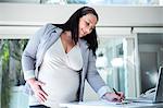 Pregnant businesswoman annotated her folder