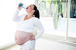 Pregnant woman drinking some water