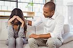 Male therapist counseling female patient