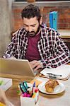 Young man working with laptop