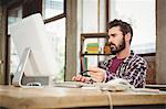 Serious man working on computer