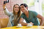 Students taking selfie in the cafe