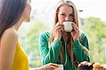 Pretty students having coffee together