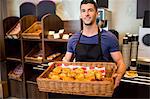 Handsome waiter smiling at camera