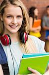 Student smiling at camera outside