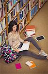 High angle view of serious woman studying