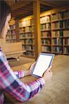 Female student holding digital tablet