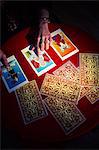 Overhead view of fortune teller using tarot cards