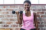 Fit smiling woman doing some exercise sit on a box