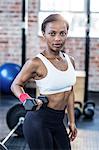 Muscular woman posing to the camera