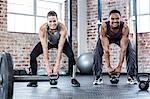 Fit couple lifting kettle bells