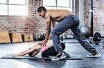 Fit couple doing a body stretching