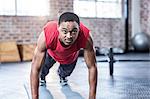 Muscular man doing push ups