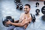 Muscular man doing abdominal exercises